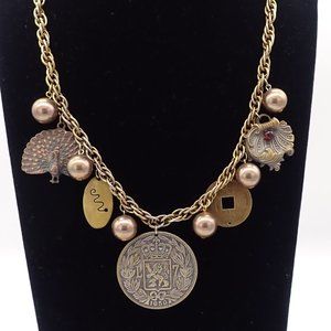 Vintage material, gold/brass tone charm, medallion necklace.